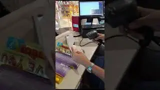 IDE303 Barcode Scanner reads Passport and Boarding Pass in Duty-free Shop