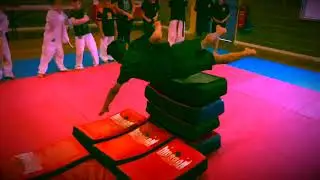 Martial arts training: Flying shoulder roll over strike shields