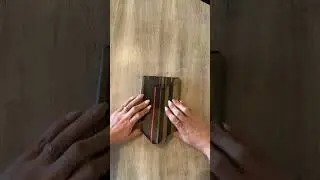 Wrapping a gift with Crisp Olive&trade; double sided premium quality wrapping paper