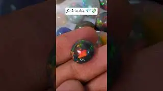 A flawless, high-grade Opal Cabochon you have to see to believe. The Green & Red fire is INSANE!