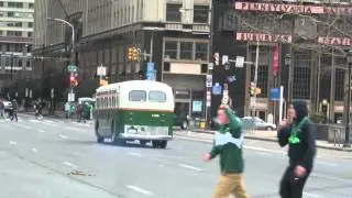 Very old bus driving around in city hall