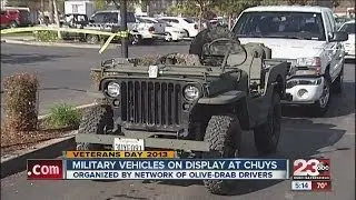Olive-Drab drivers display military vehicles at Chuy's