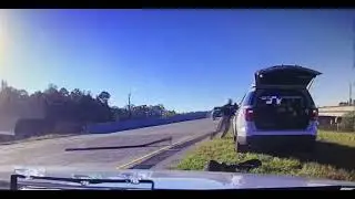 Suspect tries to hit deputy deploying spike strips.