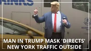 Man in Trump mask 'directs' New York traffic outside Trump Tower