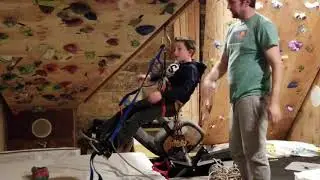 Colin learning aid climbing for the first time in the basement