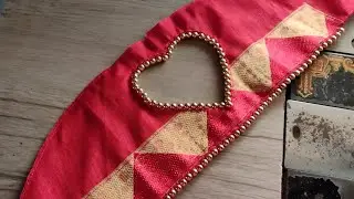 Heart shape sleeves design with pearls .