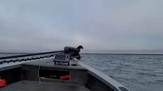 Crestliner 1850 fish hawk driving into rough water.