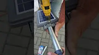 Fijando la l&aacute;mpara al poste