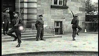 Soldiers and civilians have their passes checked at the Palace of Justice during ...HD Stock Footage