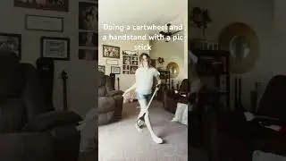 Doing a cartwheel in a handstand with a pic stick