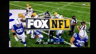 Raven Greene #24 punching out turnover back Packers/Colts