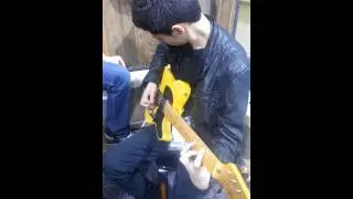 Daniel Macal trying out a Carr Impala at NAMM 2013