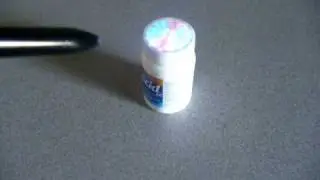 Pharmaceutical Bottle with Covert Label Authentication Cap
