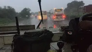 VRL Volvo Overtake 2 GSRTC Deluxe Bus in NH48 in Rain.