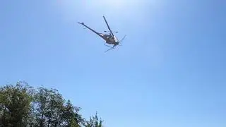 Helicopter spraying crops during drought in Washington State