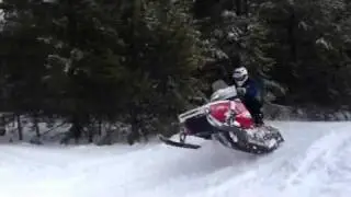 Phazer jumping a snow bank in lake chelan