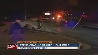Teens crash car into light pole