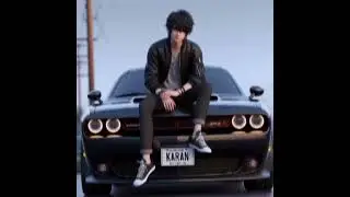 ai Boy sitting on black Dodge Challenger Number plate name 