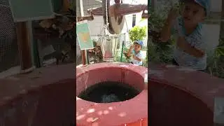 Drawing water from a well @ Ekta Nursery SoU