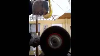 rust removing with wire brush in bench grinder