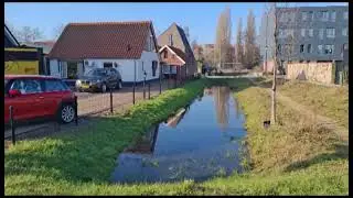 Bioswales grass filled grid pavers Ravelijn nature inclusive buildings Nijkerk, The Netherlands