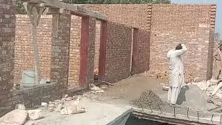Construction Laborer Working on Traditional Brick Building | On-Site Masonry Work