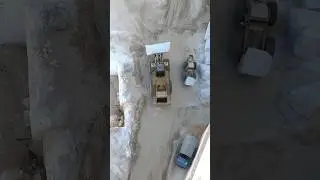 The giant's ROAR: Drone captures CAT 993K Wheel Loader  moving marble block. #shorts #construction