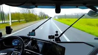 Driving DAF XF 480 truck through Belgium on rainy day