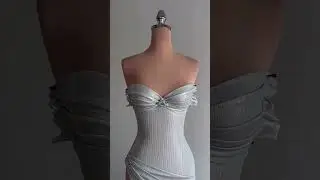 Share with a friend who would own the spotlight in this ice-silver fitted corset gown! To order,