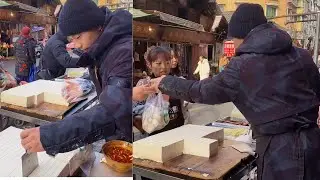 The stall sells tofu, which is freshly made and sold on February 1st.