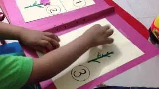 Ritwik doing Math activity as a part of his montessori-inpired shelf work!
