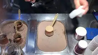 Making of Turkish coffee with Hazelnut flavor in hot sand.
