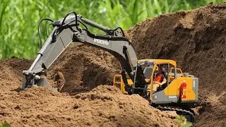 The Volvo E598 (EC160e) RC excavator carries out earthmoving at full power