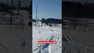 Air time on snowmobile close call