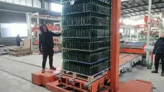A stunning scene of multi-colored glass bottles being packaged.