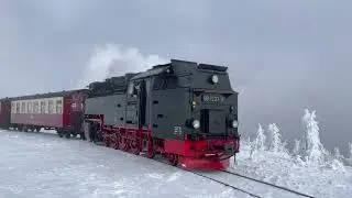 Train Emitting Heavy Smoke on the Track