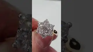 3 diamond cluster style rings showing different features and prices. This ring is one of the three.