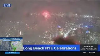 Fireworks light up rainy sky in Long Beach