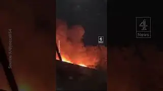 Watch as a train rolls through a Canadian city whilst on fire