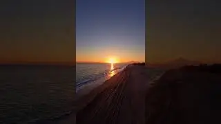 Playing on the sunset #beach #sunset #travel #dji #sunrise #shortsviral #summer #mountains