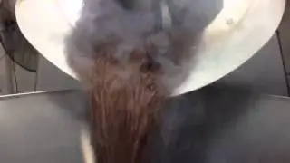 Mezzo Coffee Beans Coming Off A Roasting Machine