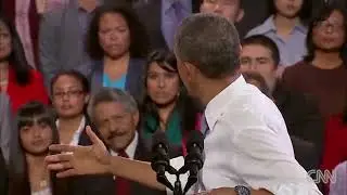 President Barack Obama addresses hecklers during his immigration reform speech