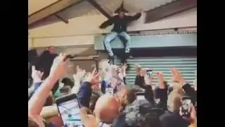 Leeds fans going mental in the concourse at Brighton on Friday night.