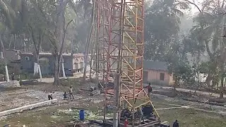Construction of a ten-story building. Inserting pillars underground with modern machines.