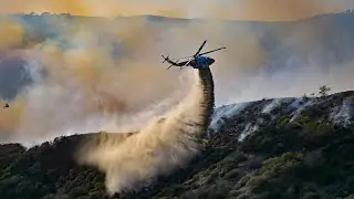 Wildfire burns across 200 acres in Orange County, California, damaging homes
