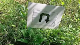 Direction sign in a park.