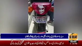 A motorcyclist jumps into the river on the Indus River Kotri Bridge