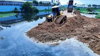 Nice construction work by bulldozer SHUNTUI C2 pushing soil developing foundation road