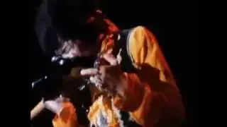 Jimi Hendrix Playing Guitar With His Teeth