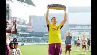 Justin Rasmussen lifts log slice after preserving the club's 100th MLS clean sheet